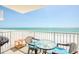 Charming balcony with comfortable seating and stunning ocean views, perfect for relaxing and enjoying the coastal breeze at 18650 Gulf Blvd # 313, Indian Shores, FL 33785