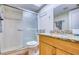 Bathroom showcasing a glass-enclosed shower, granite vanity, and neutral tones for a clean and modern aesthetic at 18650 Gulf Blvd # 313, Indian Shores, FL 33785