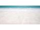 Expansive white sandy beach with clear turquoise water, offering a tranquil and picturesque coastal escape at 18650 Gulf Blvd # 313, Indian Shores, FL 33785