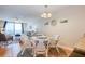 Charming dining area with seating for four and a glimpse of the living room and ocean at 18650 Gulf Blvd # 313, Indian Shores, FL 33785