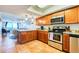 Well-equipped kitchen with stainless steel appliances and granite countertops, open to the living area at 18650 Gulf Blvd # 313, Indian Shores, FL 33785