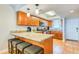 A well-lit kitchen featuring granite counters, stainless steel appliances, and a convenient breakfast bar with seating at 18650 Gulf Blvd # 313, Indian Shores, FL 33785