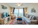 Inviting living room with a beautiful ocean view through sliding glass doors at 18650 Gulf Blvd # 313, Indian Shores, FL 33785