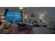 Cozy living room with comfy seating and a beautiful view of the ocean beyond the balcony at 18650 Gulf Blvd # 313, Indian Shores, FL 33785