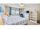 Serene main bedroom with a ceiling fan, light walls, and beachy accents, creating a relaxing coastal retreat at 18650 Gulf Blvd # 313, Indian Shores, FL 33785