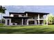 Back of contemporary home with multiple windows and a covered patio, offering seamless indoor-outdoor living at 19207 Gunn Hwy, Odessa, FL 33556