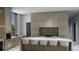 Modern kitchen with a marble countertop island, stylish backsplash, and high-end appliances at 19211 Gunn Hwy, Odessa, FL 33556