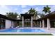 Beautiful backyard pool with integrated spa and covered patio, perfect for enjoying outdoor living and entertaining at 19211 Gunn Hwy, Odessa, FL 33556