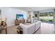Bright living room featuring a decorative wall, modern furniture, and sliding doors to an outdoor patio at 19720 Gladeview Way, Land O Lakes, FL 34638
