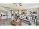 Spacious living room with neutral colors, tile floor, and plenty of natural light at 19752 Gladeview Way, Land O Lakes, FL 34638