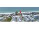Stunning aerial view of a beachfront condo with incredible beach access and nearby community pools at 19910 Gulf Boulevard # 102, Indian Shores, FL 33785