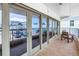 This wide, covered balcony with multiple access doors offers amazing views at 19910 Gulf Boulevard # 102, Indian Shores, FL 33785