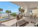 Large balcony with ample seating, perfect for enjoying the ocean breeze and views at 19910 Gulf Boulevard # 102, Indian Shores, FL 33785