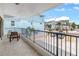 A relaxing covered balcony features tile floors, seating, and neighborhood views at 19910 Gulf Boulevard # 102, Indian Shores, FL 33785