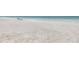 Expansive white sand beach with views of the ocean at 19910 Gulf Boulevard # 102, Indian Shores, FL 33785