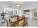 Dining room featuring an open floor plan to the kitchen and wet bar at 19910 Gulf Boulevard # 102, Indian Shores, FL 33785