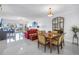 Bright living room area with ocean views, dining table, and comfortable seating at 19910 Gulf Boulevard # 102, Indian Shores, FL 33785