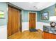 Well-maintained lobby with wood door and elevator access to resident condos at 19910 Gulf Boulevard # 102, Indian Shores, FL 33785