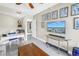 Bright office area featuring a TV and modern decor, creating a functional and stylish workspace at 19910 Gulf Boulevard # 102, Indian Shores, FL 33785