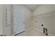 Practical laundry room equipped with essential hookups and storage shelves at 20092 Stone Pine Cir, Lutz, FL 33558