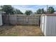 Fenced backyard offers privacy and space for outdoor activities at 2035 Erin Dr, Holiday, FL 34690