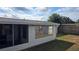 Screened in patio with backyard featuring a privacy fence and storage shed at 2035 Erin Dr, Holiday, FL 34690