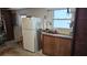 The basement offers extra storage with a refrigerator and a convenient workbench at 2035 Erin Dr, Holiday, FL 34690