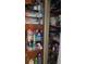 Linen closet with shelves stocked with towels, toiletries, and other bathroom essentials at 2035 Erin Dr, Holiday, FL 34690