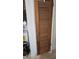 A wooden door with horizontal grooves at 2035 Erin Dr, Holiday, FL 34690