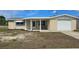 Charming single-story home featuring a unique stone facade and a cozy covered porch at 2035 Erin Dr, Holiday, FL 34690