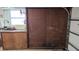 This garage includes garage door access and built-in storage cabinets at 2035 Erin Dr, Holiday, FL 34690