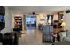 Living room with tile flooring, natural light, and access to a covered outdoor space at 2035 Erin Dr, Holiday, FL 34690