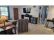 View of the living room showcasing the tile flooring and updated media center at 2035 Erin Dr, Holiday, FL 34690