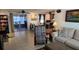 Open-concept living room with an adjacent dining area and backyard access at 2035 Erin Dr, Holiday, FL 34690