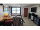 Comfortable living room with neutral tones, a large window and media center at 2035 Erin Dr, Holiday, FL 34690