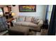 Cozy living room with neutral decor and a view into the kitchen at 2035 Erin Dr, Holiday, FL 34690