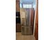 Stainless steel refrigerator with double doors, harmonizing with the kitchen's design and cabinetry at 2035 Erin Dr, Holiday, FL 34690