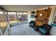 Spacious screened patio with backyard views, perfect for relaxing or entertaining at 2035 Erin Dr, Holiday, FL 34690