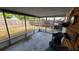 Enclosed screened patio perfect for outdoor relaxation and entertaining at 2035 Erin Dr, Holiday, FL 34690