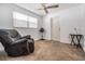Bedroom featuring carpet flooring and a cozy recliner at 2111 W Grace St, Tampa, FL 33607