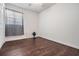 Bedroom with dark wood floors, white walls, and a window at 2111 W Grace St, Tampa, FL 33607