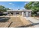 Charming single-story home with tidy front yard, sidewalk, and landscaped areas at 2111 W Grace St, Tampa, FL 33607