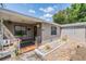 Charming bungalow with a landscaped front yard, a cozy porch, and secure windows at 2111 W Grace St, Tampa, FL 33607