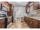 Traditional kitchen with stainless steel appliances and decorative backsplash at 2111 W Grace St, Tampa, FL 33607