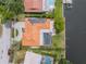 Aerial view of home with solar panels, pool and canal access at 2146 Egret Drive, Clearwater, FL 33764