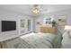 Bedroom with hardwood floors, french doors to patio, and a decorative dresser at 2146 Egret Drive, Clearwater, FL 33764