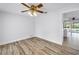 Simple dining room featuring wood-look floors, white walls, and a view into the backyard at 2146 Egret Drive, Clearwater, FL 33764