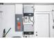 Updated electrical panel inside near a white door at 2146 Egret Drive, Clearwater, FL 33764