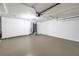 Spacious garage featuring epoxy flooring, utility connections, and ample storage space at 2146 Egret Drive, Clearwater, FL 33764