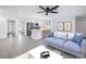 Open-concept living room and kitchen, decorated with stylish furniture and neutral colors at 2146 Egret Drive, Clearwater, FL 33764